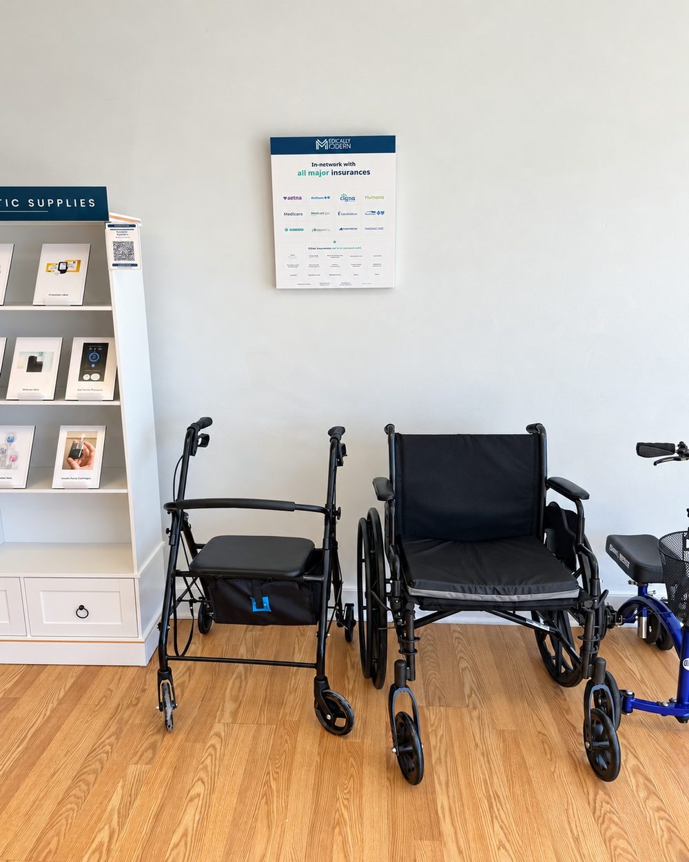 Walker, wheelchair and knee scooter on display beside the diabetic supplies shelf at the Medically Modern Mount Kisco store